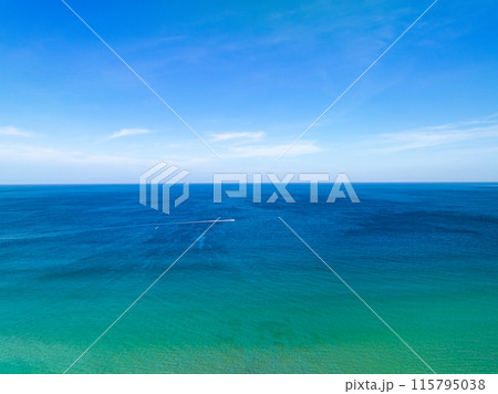 Aerial view of a blue sea surface water texture background,Sun reflections over ocean, Aerial flying drone view Waves water surface texture on sunny tropical ocean in Phuket island Thailand Aerial view of a blue sea surface water texture background,Sun reflections over ocean, Aerial flying drone view Waves water surface texture on sunny tropical ocean in Phuket island Thailand 115795038