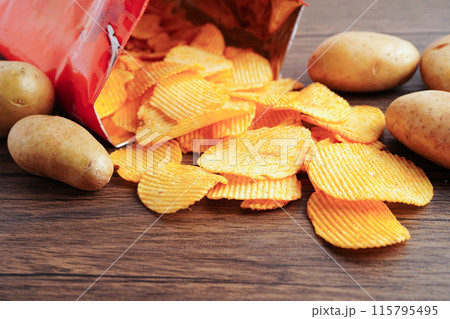 Potato chips , delicious BBQ seasoning spicy for crips, thin slice deep fried snack fast food. 115795495