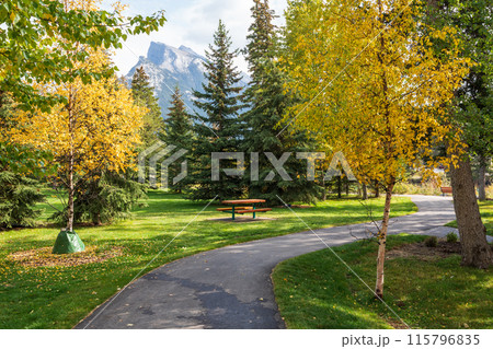 Town of Banff Central Park Bow River Trail in autumn day. Banff National Park, Canadian Rockies, Alberta, Canada. Town of Banff Central Park Bow River Trail in autumn day. Banff National Park, Canadian Rockies, Alberta, Canada. 115796835