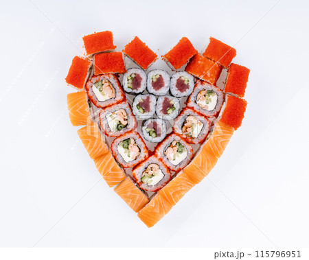 Heart shaped set of sushi rolls for Valentine's Day. Menu or delivery concept, Top view 115796951