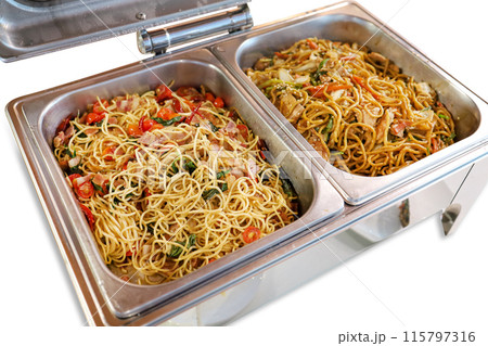 Top view of soba noodles, stir fried soy sauce in stainless steel countertop, focus selective 115797316