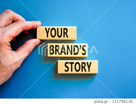 Branding and your brand story symbol. Concept words Your brands story on beautiful wooden blocks. Beautiful blue background. Businessman hand. Business branding your brand story concept. Copy space. Branding and your brand story symbol. Concept words Your brands story on beautiful wooden blocks. Beautiful blue background. Businessman hand. Business branding your brand story concept. Copy space. 115798116