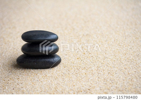 Zen stones on beach sand with customizable space for text or ideas Zen stones on beach sand with customizable space for text or ideas 115798480