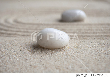 Close up of white zen stones line with customizable space for text. 115798488