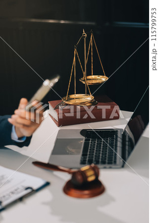 Male lawyer working with contract papers and wooden gavel on tabel in courtroom. justice and law ,attorney, court judge, concept. 115799753