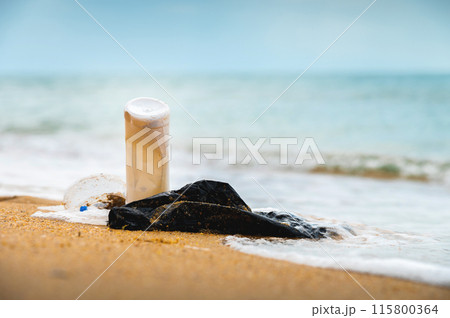 Plastic pollution on the beach. Garbage washed ashore by the sea. Ecological problem Plastic pollution on the beach. Garbage washed ashore by the sea. Ecological problem 115800364