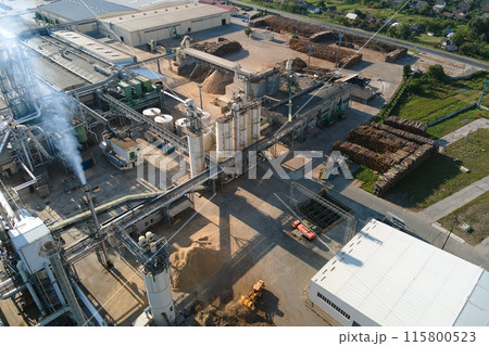 Aerial view of oil and gas refining petrochemical factory with tall refinery plant manufacture structure. Aerial view of oil and gas refining petrochemical factory with tall refinery plant manufacture structure. 115800523