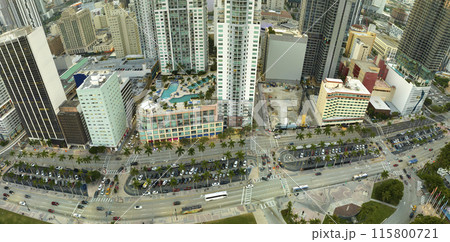 Aerial view of heavy traffic on urban street in downtown office district of Miami Brickell in Florida, USA. High commercial and residential skyscraper buildings in modern american megapolis Aerial view of heavy traffic on urban street in downtown office district of Miami Brickell in Florida, USA. High commercial and residential skyscraper buildings in modern american megapolis 115800721
