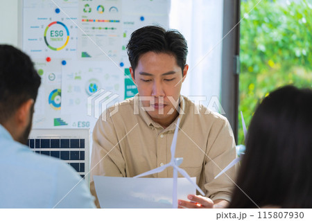 diversity team brainstorming discussion focused on ESG (environment,social,governance)  for sdgs goals in a sustainable green office 115807930