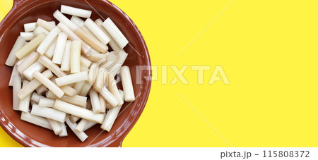 Fresh lotus rootlet on yellow background. Fresh lotus rootlet on yellow background. 115808372