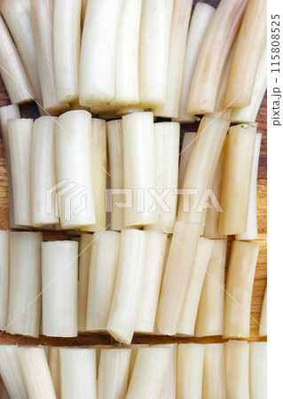Fresh lotus rootlet on wooden cutting board. 115808525
