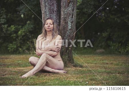Naked dirty woman in the evening forest 115810615