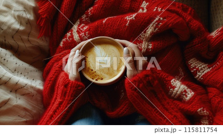 The cup rests in her hands, an invitation to indulge in a moment of bliss. 115811754