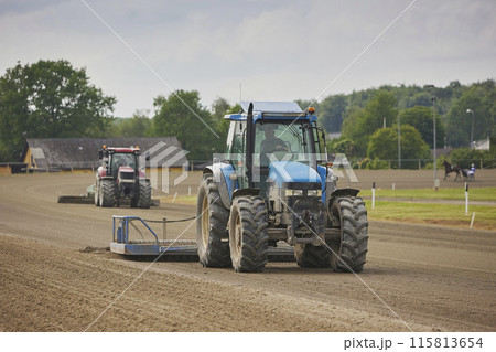 Tractors prepare a racetrack for racing in Denmark Tractors prepare a racetrack for racing in Denmark 115813654