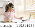 Young woman using a laptop, Work from the comfort of home, Use your laptop for work and communication, Work from home. 115814924
