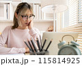 Young woman using a laptop, Work from the comfort of home, Use your laptop for work and communication, Work from home. 115814925