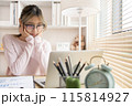 Young woman using a laptop, Work from the comfort of home, Use your laptop for work and communication, Work from home. 115814927