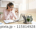 Young woman using a laptop, Work from the comfort of home, Use your laptop for work and communication, Work from home. 115814928