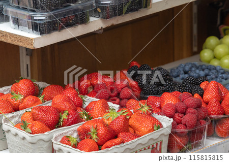 Strawberries, raspberries and blackberries in a close-up view. 115815815