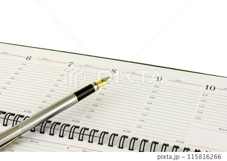 Leaf diary and fountain pen indicates the date of March 8 115816266