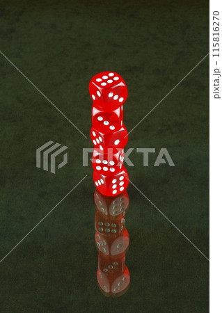 The glass surface reflects red dice poker The glass surface reflects red dice poker 115816270