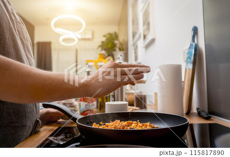 Chef at the kitchen preparing quesadillas with tofu and sweet corn 115817890