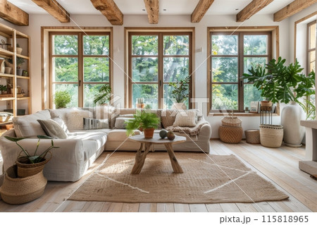 Cozy living room with large wooden window frames and natural light 115818965