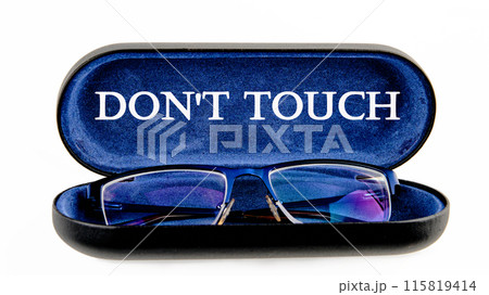 Words DO NOT TOUCH written symbol on the inside of the glasses case on a white background Words DO NOT TOUCH written symbol on the inside of the glasses case on a white background 115819414