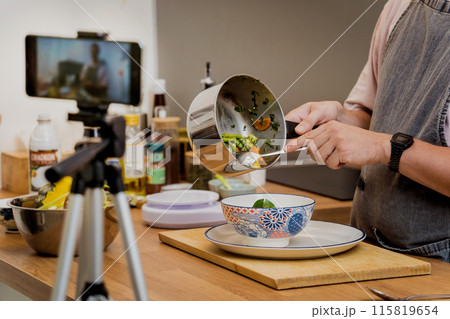 The chef is broadcasting live from workshop how to prepare a vegetarian green curry 115819654