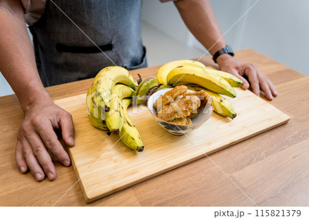 Crispy fried bananas in the small white bowl Crispy fried bananas in the small white bowl 115821379