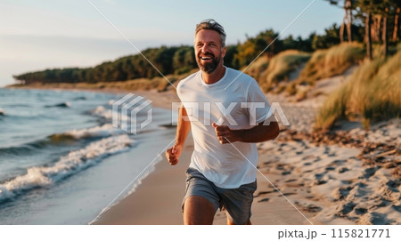 Man running on a beach, jogging, healthy cardio exercise. 115821771