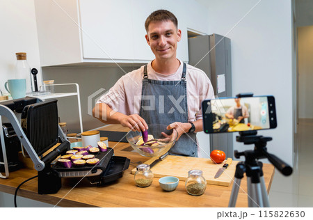 The chef is broadcasting live from workshop how to prepare a grilled eggplants with garlic The chef is broadcasting live from workshop how to prepare a grilled eggplants with garlic 115822630