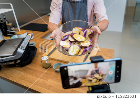 The chef is broadcasting live from workshop how to prepare a grilled eggplants with garlic The chef is broadcasting live from workshop how to prepare a grilled eggplants with garlic 115822631