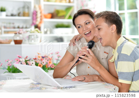 Close up portrait of mother and son using modern laptop Close up portrait of mother and son using modern laptop 115823598