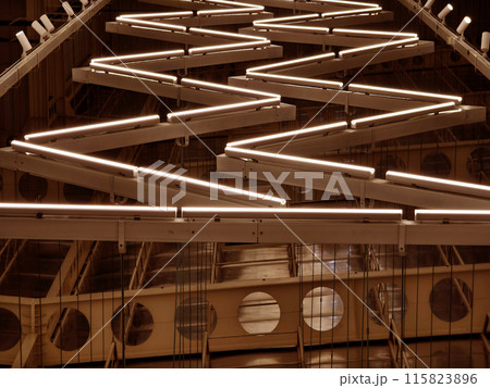 Ceiling with pipes is beautifully decorated with many industrial lamps Ceiling with pipes is beautifully decorated with many industrial lamps 115823896