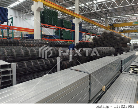 A big warehouse packed with numerous metallic nets and profile 115823982