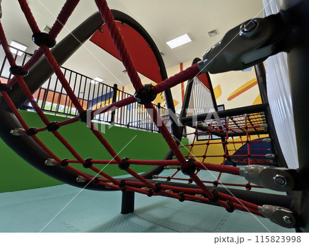 The trampoline features a mazepatterned surface for recreational use indoors The trampoline features a mazepatterned surface for recreational use indoors 115823998