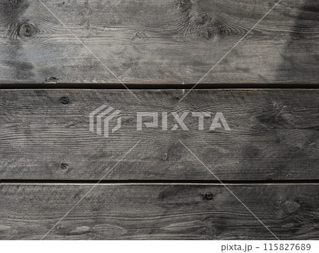 Texture of old wooden shabby planks with cracks and stains. Abstract background 115827689