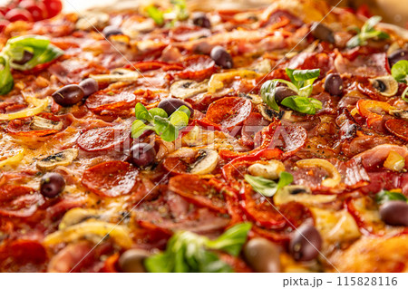 Delicious pizza with pepperoni Delicious pizza with pepperoni 115828116