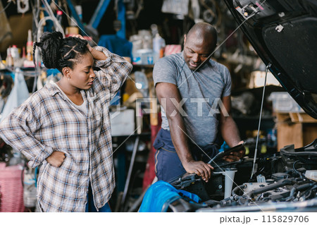 Mechanic man talking with stress worry customer inform explain car problem, service detail hard decision in garage. 115829706