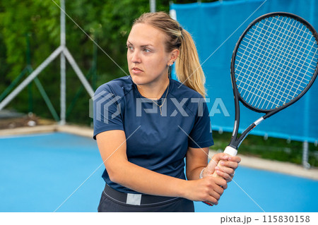 Professional female tennis player playing in tennis with racket and ball on outside court 115830158