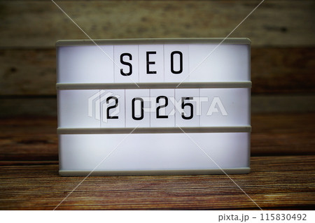 SEO 2025 letterboard text on LED Lightbox on wooden background, business and technology concept background SEO 2025 letterboard text on LED Lightbox on wooden background, business and technology concept background 115830492
