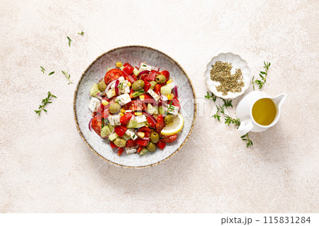Salad with feta cheese, olives and fresh vegetables, top view Salad with feta cheese, olives and fresh vegetables, top view 115831284