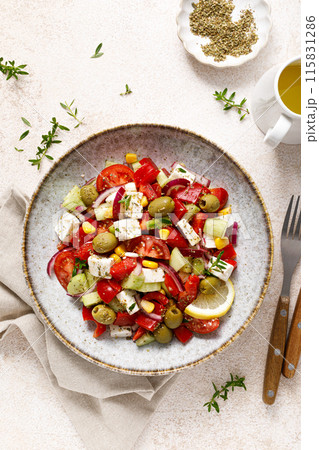 Salad with feta cheese, olives and fresh vegetables, top view 115831286