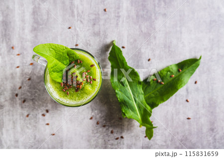 Close up of refreshing smoothie made from sorrel leaves and flax seeds in a glass top view 115831659