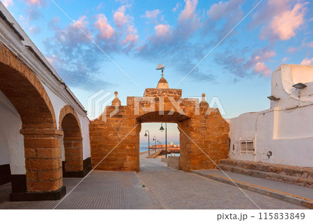 Stone Archway Leading to San Sebastian Fort, Cadiz, Spain at dawn 115833849