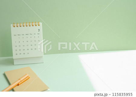 Calendar and notepad, pen for schedule, business, vacation plan on mint green desk background Calendar and notepad, pen for schedule, business, vacation plan on mint green desk background 115835955