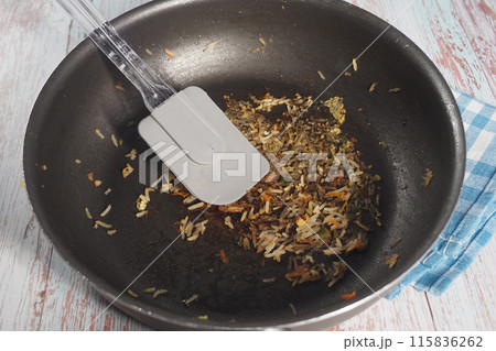 A Dirty Frying Pan top view  115836262