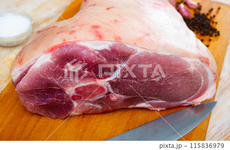 Raw pork leg with herbs and condiments ready for cooking Raw pork leg with herbs and condiments ready for cooking 115836979