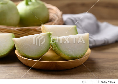 Kohlrabi or turnip cabbage on wooden background, Edible vegetable both raw and cooked Kohlrabi or turnip cabbage on wooden background, Edible vegetable both raw and cooked 115837433
